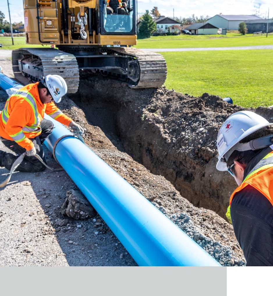 Aecon workers building pipeline.
