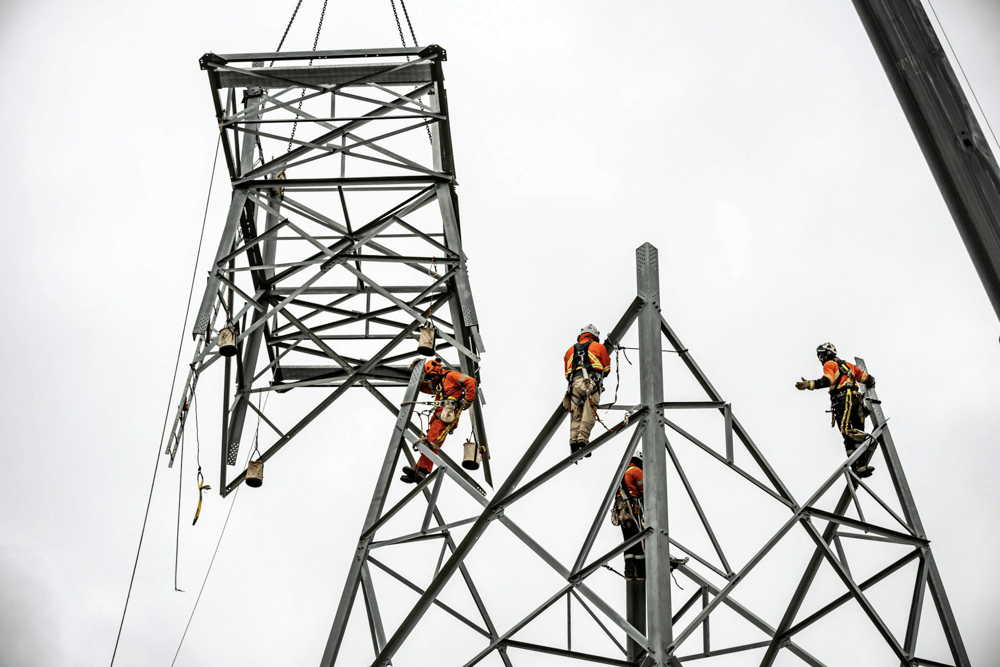 Men working on an electrical tower